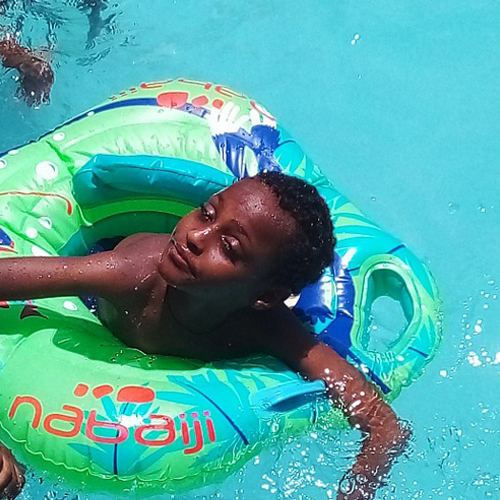 Makbel floating in the pool